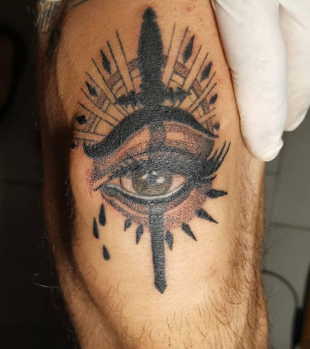Black Dagger Eye Tattoo on Knee