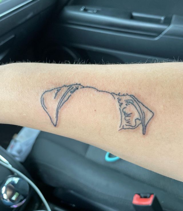 Pretty Dog Ear Tattoo on Forearm