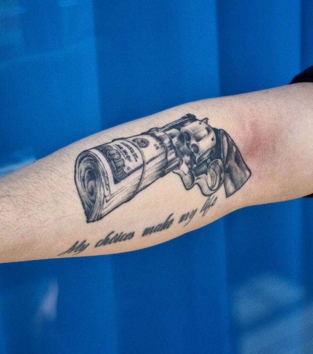 Dollar Revolver Tattoo on Forearm