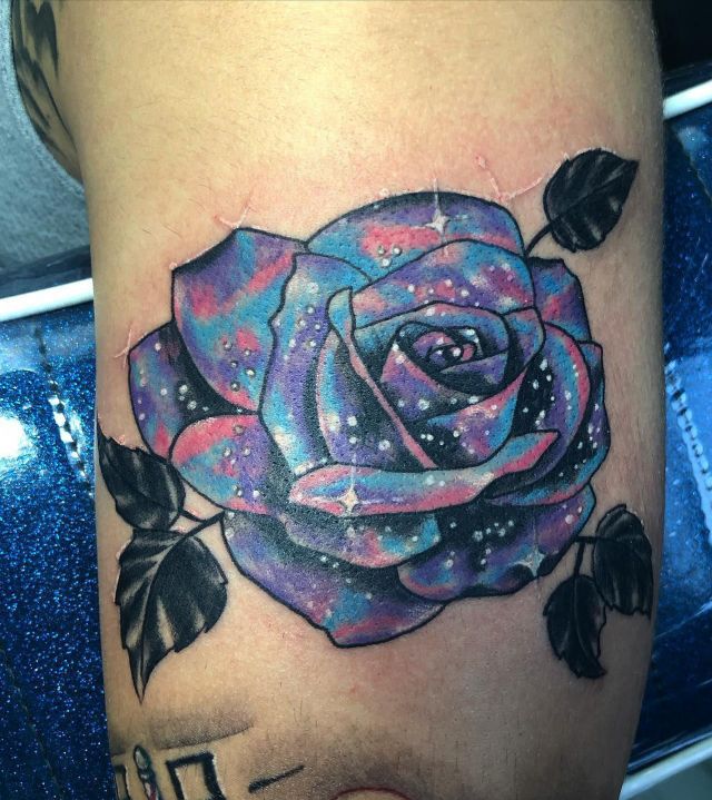 Pretty Space Rose Tattoo on Upper Arm