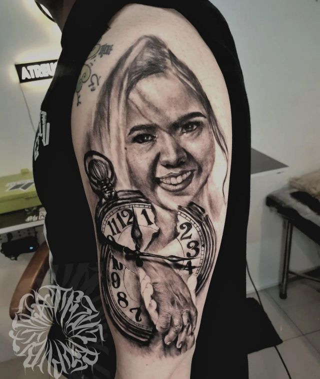 Cool Broken Clock Tattoo on Upper Arm
