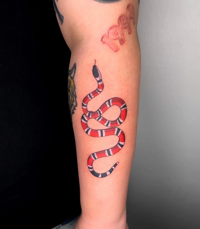 Elegant Gucci Snake Tattoo on Forearm