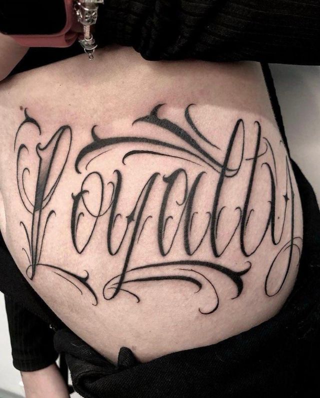 Elegant Loyalty Tattoo on Belly