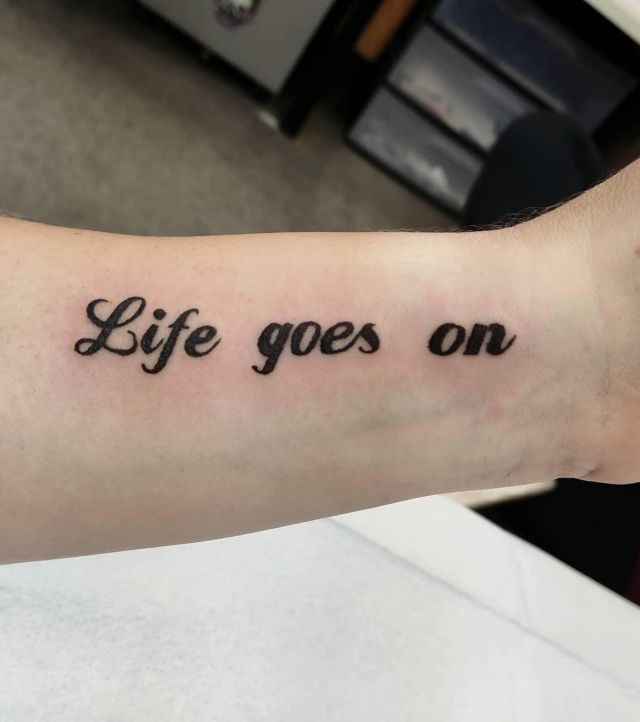 Elegant Life Goes On Tattoo on Forearm