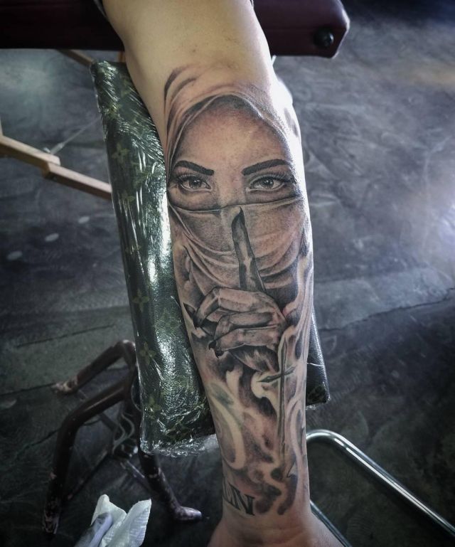 Masked woman Speak No Evil Tattoo on Arm