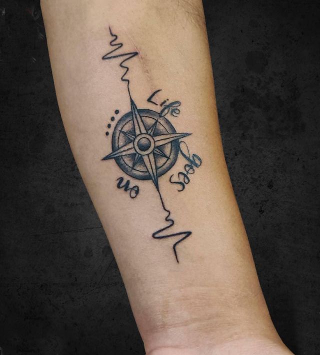 Compass Life Goes On Tattoo on Forearm