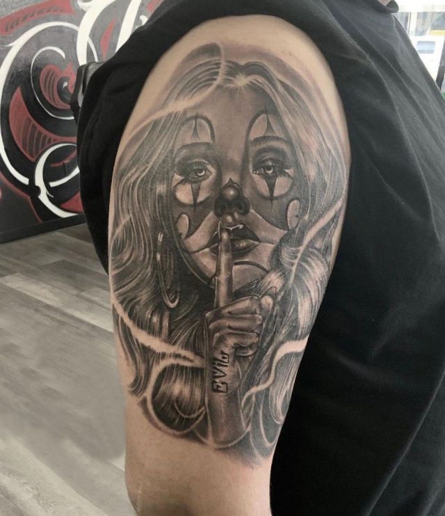 Clown Girl Speak No Evil Tattoo on Upper Arm