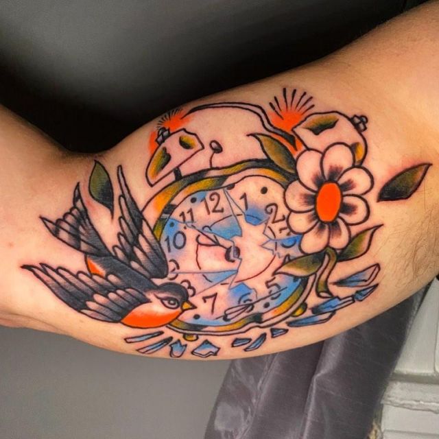Bird Flower and Broken Clock Tattoo on Upper Arm