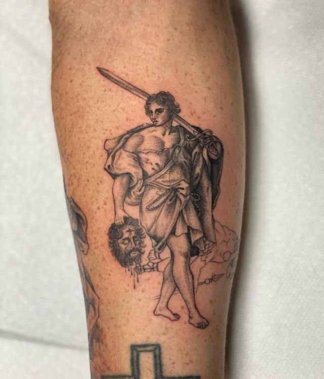 Cool David and Goliath Tattoo on Arm