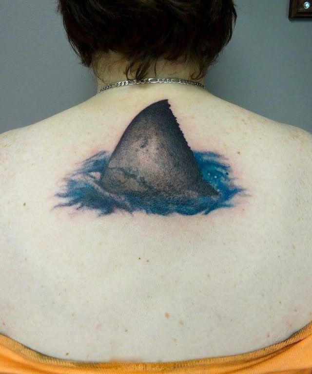 Unique Shark Fin Tattoo on Back