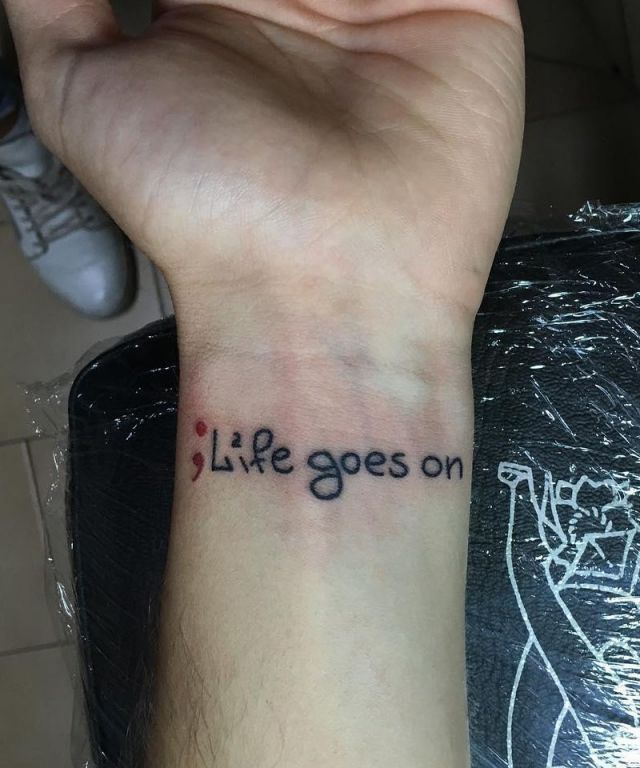 Semicolon and Life Goes On Tattoo on Wrist
