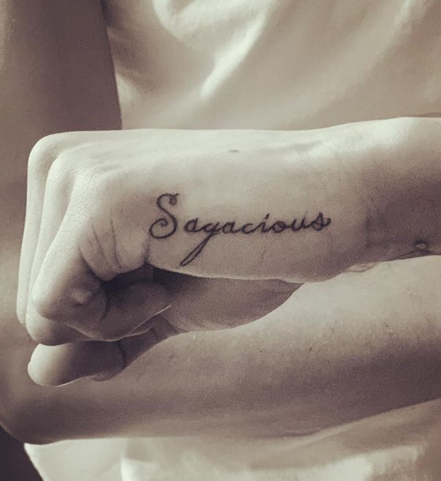 Sagacious Side Hand Tattoo