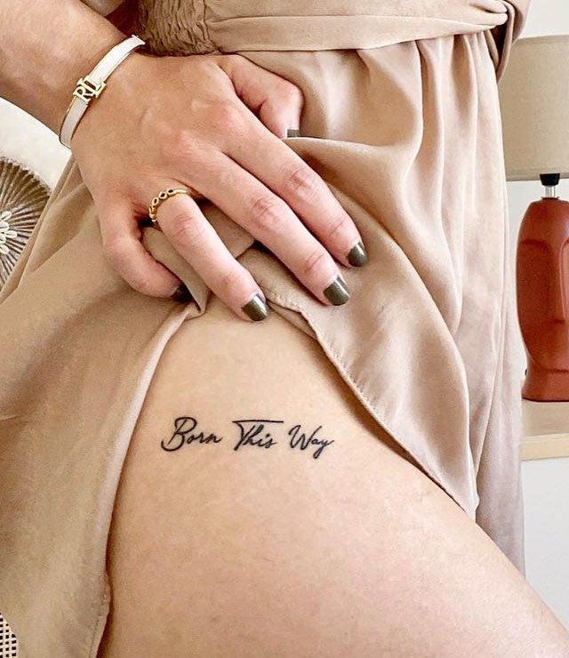 Elegant Born This Way Tattoo on Thigh