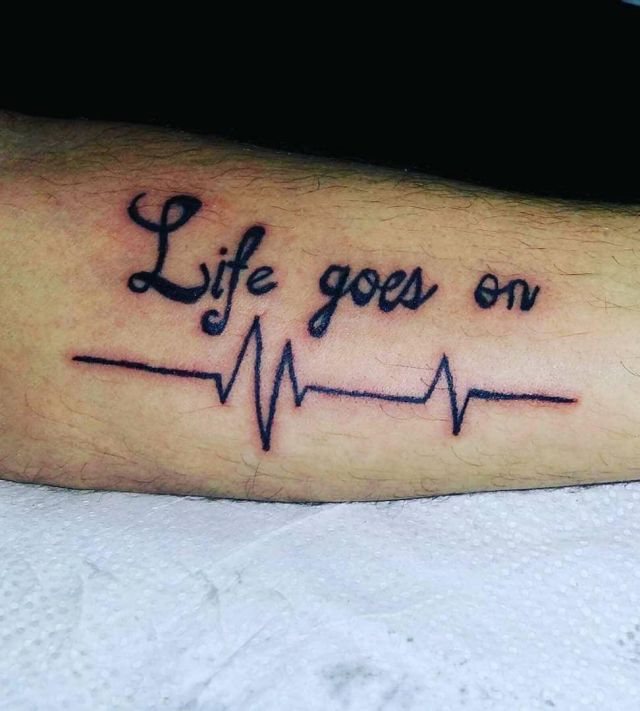 Electrocardiogram and Life Goes On Tattoo on Log