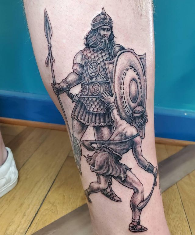 Cool David and Goliath Tattoo on Leg