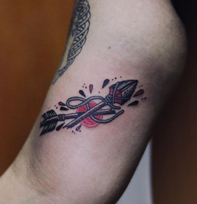 Unique Broken Arrow Tattoo on Upper Arm