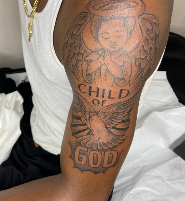 Cute Child Of God Tattoo on Upper Arm
