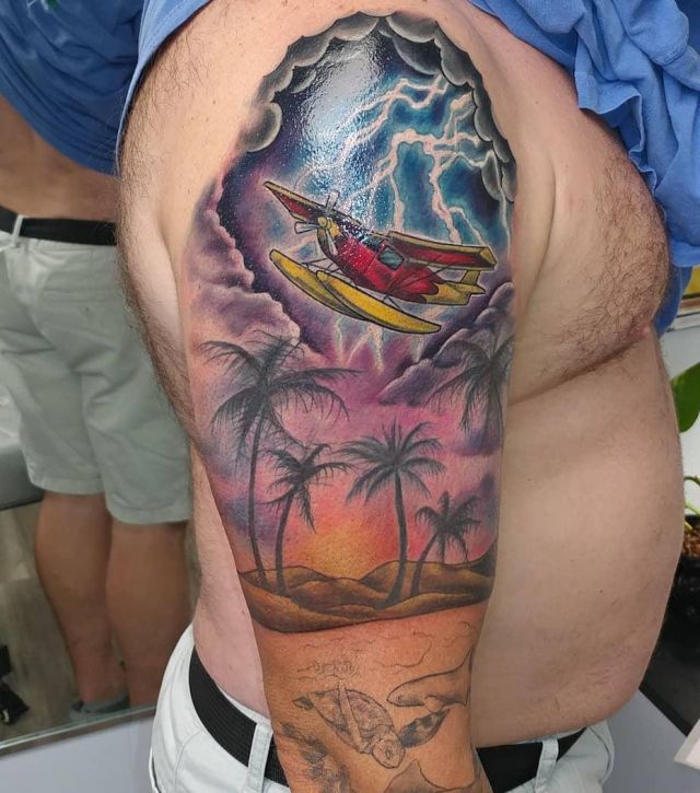 Lightning Seaside Seaplane Tattoo on Upper Arm