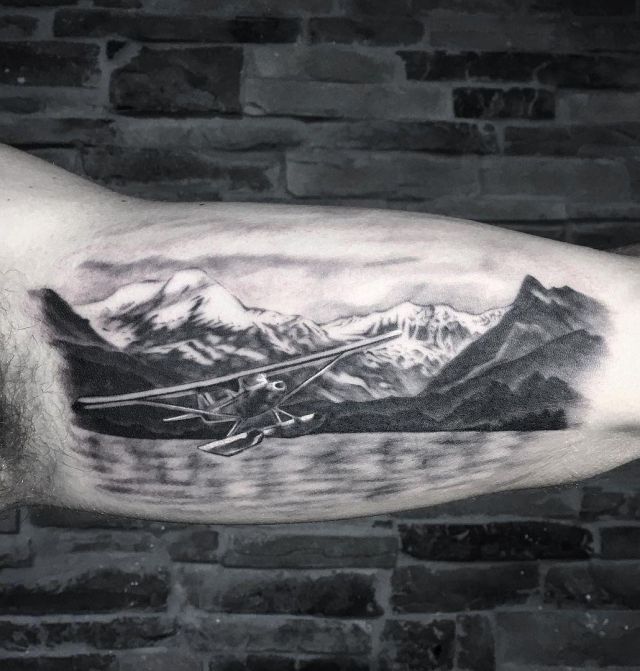 Mountain Seaplane Tattoo on Arm