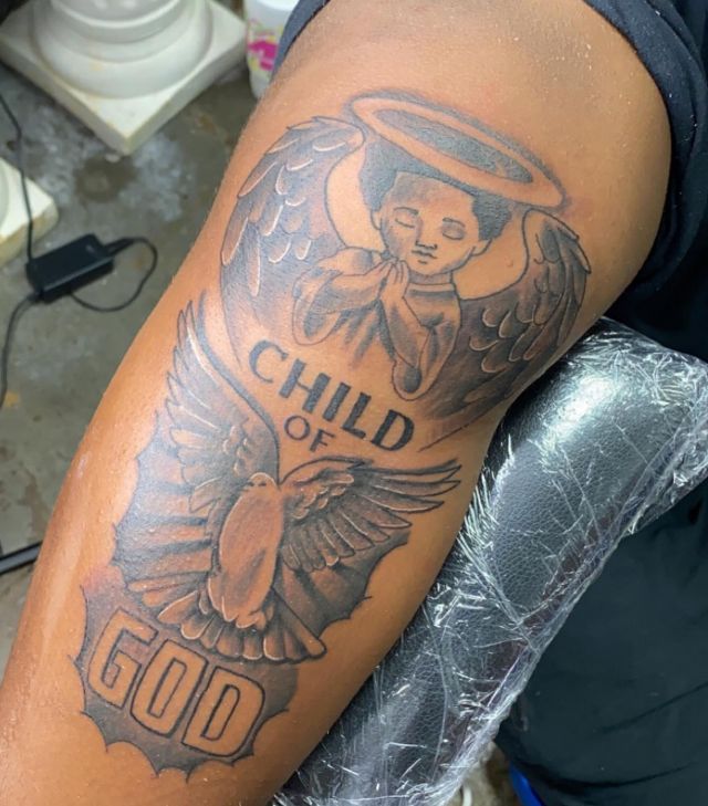 Unique Child Of God Tattoo on Upper Arm