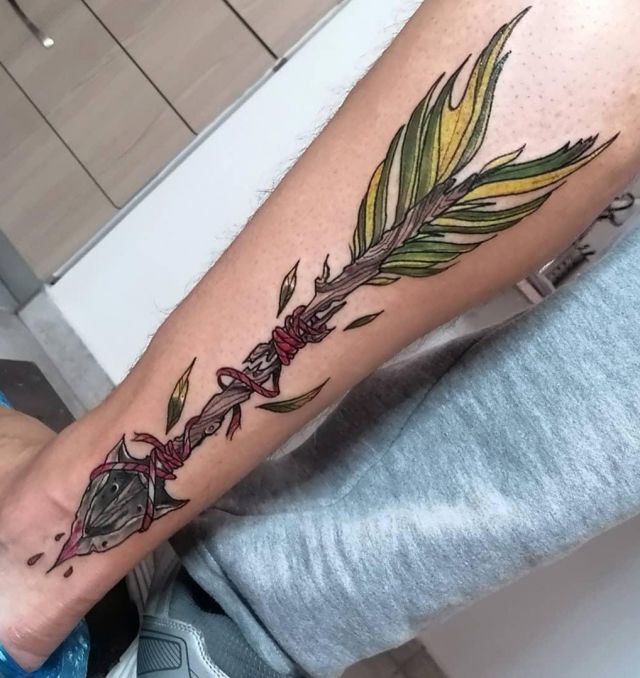 Pretty Broken Arrow Tattoo on Leg